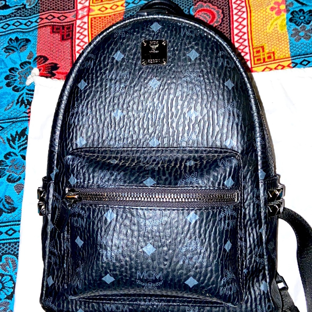 It has diamonds all on the side of the bag still in good shape MCM bag black